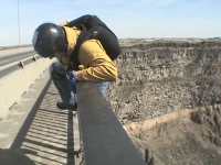 Me climbing over the railing at Twin Falls